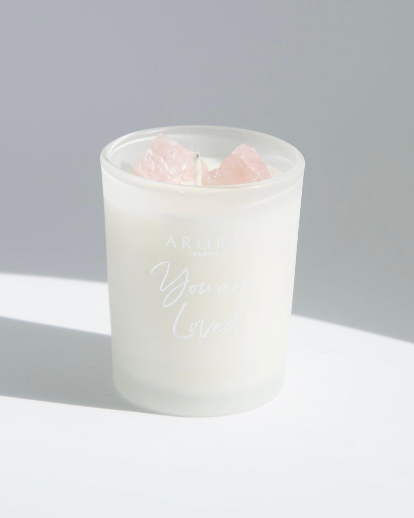 Arora London  You are Loved Rose Quartz Crystal Travel Candle infused with Patchouli and Orange essential oils in 9cl frosted glass container